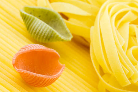 Closeup shoot of different types of raw pastaの写真素材