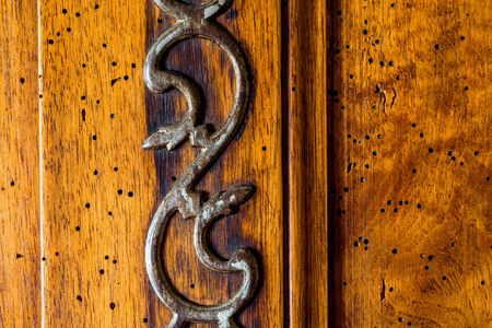 Closeup on old wood cabinet with its old keyの写真素材