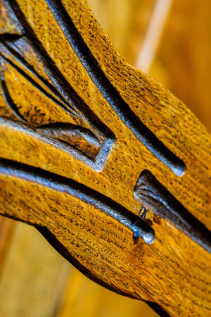 closeup symbols engraving on luxurious wood cabinetの写真素材