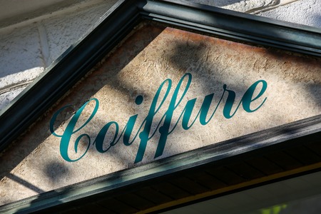 closeup on shop front of an hairdressing salonの写真素材