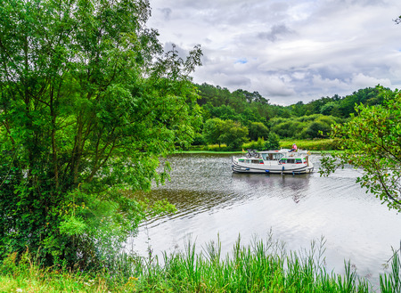 Picture of a beautifful boat crossing the riverのeditorial素材