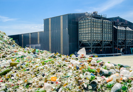 Heap of glass bottles near a recycling plantのeditorial素材