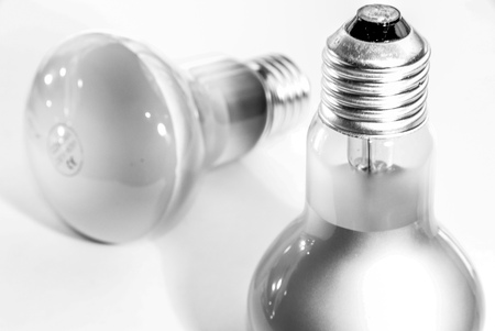 Incandescent and fluorescent energy saving light bulbsの写真素材