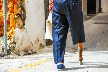 a closeup picture of a one legged man from behindの写真素材