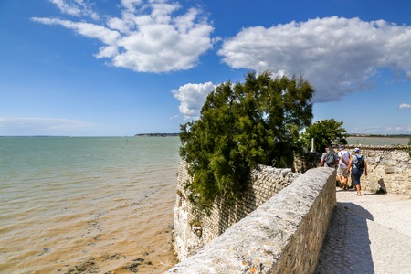 Overlooking an estuary on Atlantic near a small traditional fortified French villageの写真素材