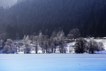 Landscape of frozen Longemer lake in the Vosges Mountain, Franceの写真素材