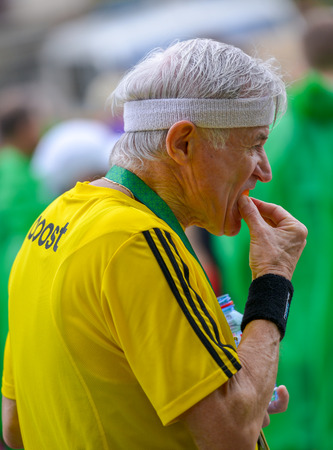 PARIS, FRANCE - APRIL 06: old man in backstage of finishing line at Paris International Marathon on April 06, 2014 in Paris, Franceのeditorial素材
