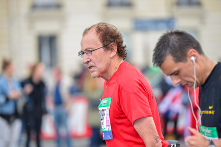 PARIS, FRANCE - APRIL 06: man isolated at Paris International Marathon on April 06, 2014 in Paris, Franceのeditorial素材