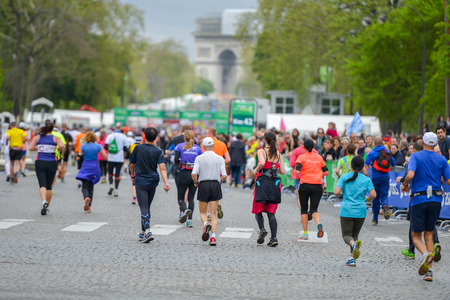 PARIS, FRANCE - APRIL 06: Marathon runners finishing line at Paris International Marathon on April 06, 2014 in Paris, Franceのeditorial素材