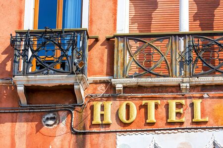 Ocher Facade of a luxury hotel with gold panelのeditorial素材
