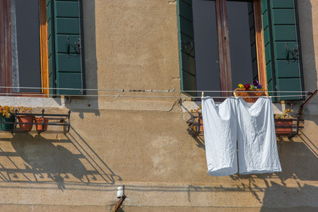 Venetian windows with the laundry drying on a wireのeditorial素材