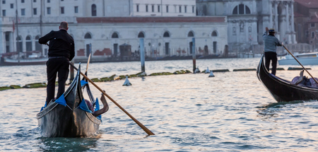Gondola on Canal Grande with Basilica di Santa Maria della Salute in the background, Venice, Italyの写真素材