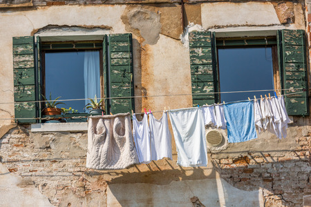 Venetian windows with the laundry drying on a wireのeditorial素材