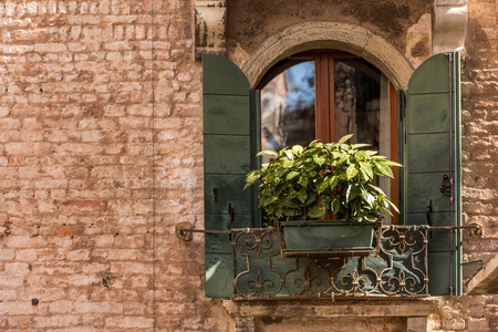 Closeup on windows windows of a typical Venetian house, Italyの写真素材