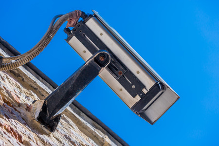 closeup view of modern security camera and urban video