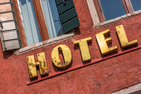 Ocher Facade of a luxury hotel with gold panelのeditorial素材