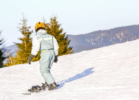 GERARDMER, FRANCE - FEB 20- Closeup on Snowborder during the annual winter school holiday on Feb 20, 2015 in Gerardmer, Franceのeditorial素材