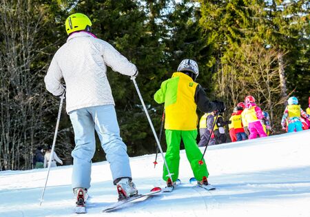 GERARDMER, FRANCE - FEB 17- Closeup on beginner skier during the annual winter school holiday on Feb 17, 2015 in Gerardmer, Franceのeditorial素材