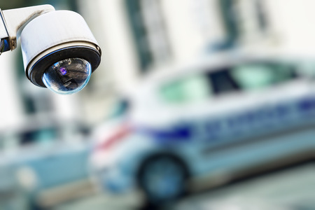 security camera and urban video with blur police car on background