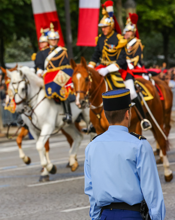 PARIS, FRANCE - JULY 14 - French Republican Guards during the ceremonial of french national day on July 14, 2014 in Paris, Champs Elysee avenue, Franceのeditorial素材