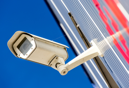 closeup on security CCTV camera or surveillance system in office building