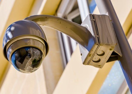 closeup on security CCTV camera or surveillance system in office building