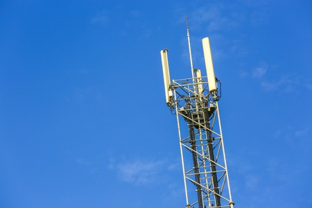 A high telecommunication network antenna and the beautiful clear blue sky
