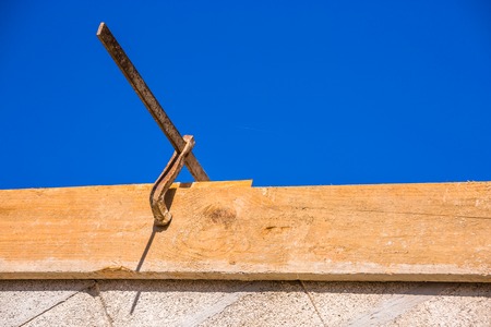 New residential construction home framing against a blue sky.の写真素材