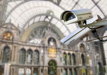 security CCTV camera or surveillance system with train station on blurry backgroundの写真素材