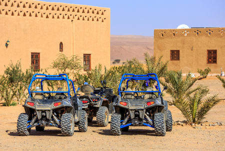 Itrane, Morocco - Feb 24, 2016: blue Polaris RZR 800 with no pilot parked in a small Berber village in Morocco desert near Merzougaのeditorial素材