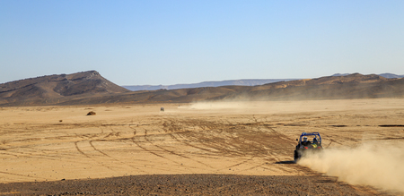 Merzouga, Morocco - Feb 25, 2016: panoramic view on convoys of offroad cars in Morocco desert near Merzouga. Merzouga is famous for its dunes, the highest in Morocco.のeditorial素材