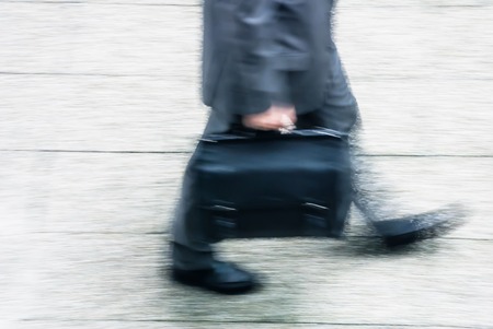 blurry to view of businessman walking in a streetのeditorial素材