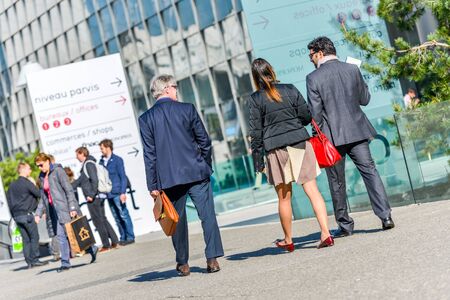 La defense, France- April 10, 2014: Group of business people walking not far from business centerのeditorial素材