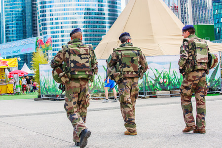 La defense, France - July 17 2016: French military patrol assigned to the surveillance of a business district near Paris. These troops ensure the safety of the citizens and are there in prevention of the terrorist attacks perpetrated in Franceのeditorial素材
