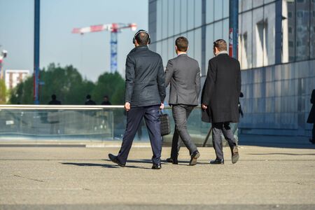 La defense, France- April 10, 2014: Group of business people walking not far from business centerのeditorial素材