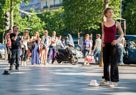 Paris, France- May 25, 2012:Modern woman dancer dancing on the street of champs elysees, france. Urban lifestyle. Hip-hop generation.のeditorial素材
