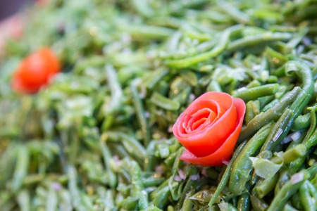 Cooked green beans with tomato during typical french buffetの写真素材