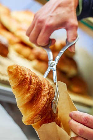 closeup on croissants with butter in french pastry shop