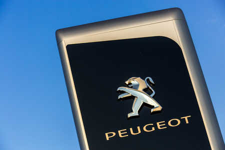 La rochelle, France - August 30, 2016: Official dealership sign of Peugeot against the blue sky. Peugeot is one of the most french automotive manufacturerのeditorial素材