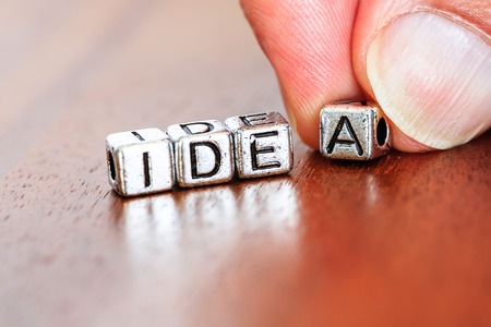 idea concept business marketing letters placed on a desk in precious woodの写真素材