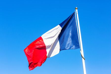 French flag under blue skyの写真素材
