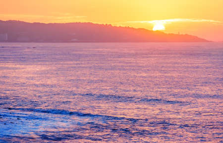 Sea Cliff on sunrise with beautiful dramatic sky and ocean shore on the backgroundの写真素材