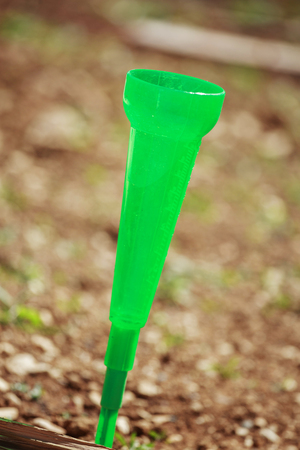 closeup on rain gauge in a garden to measure the quantity of rainの写真素材