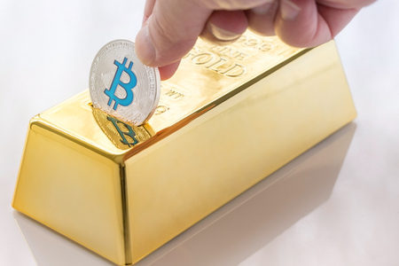 Concept of Cryptocurrency physical bitcoin with gold bullion piggy bankの写真素材