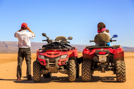 Ait Saoun, Morocco - February 22, 2016: African man and woman in buggy car at desert of Ait Saoun in Morocco.のeditorial素材