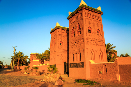 M'hamid, Morocco - February 22, 2016: typical arabic style front view of Chez le Pacha hotel outside view with blue skyのeditorial素材