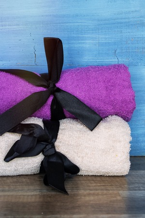 Closeup on Towels placed on a table. Beauty Spa Health and Wellness concept.の写真素材
