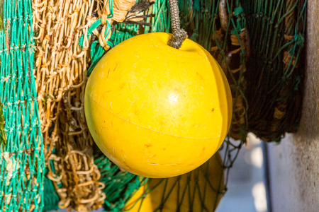 closeup on fishing nets spread out on the groundの写真素材