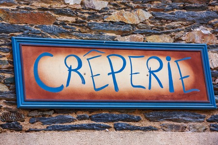 Closeup on Pancake restaurant sign ("Creperie" generic name in French). Brittany, France.の写真素材