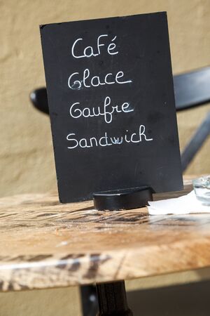 Menu written with chalk on blackboardの写真素材
